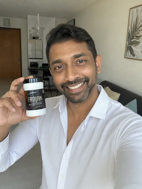 An EROJAN customer in Singapore holding their bottle